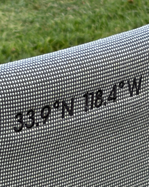 Coordinates embroidery stitched on a Common Tiger chair cover
