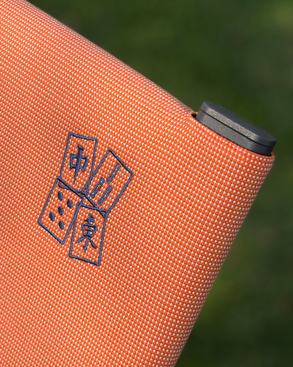 Mahjong embroidery stitched on a Common Tiger chair cover